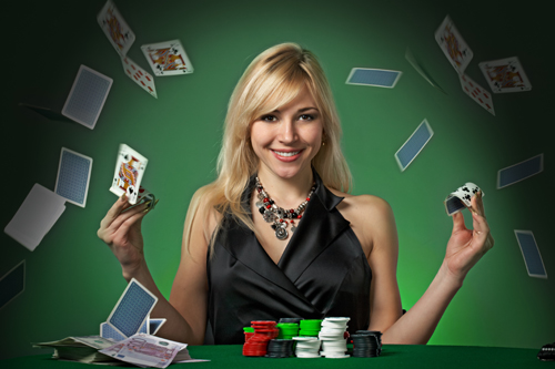 Lady flicking cards at a blackjack table