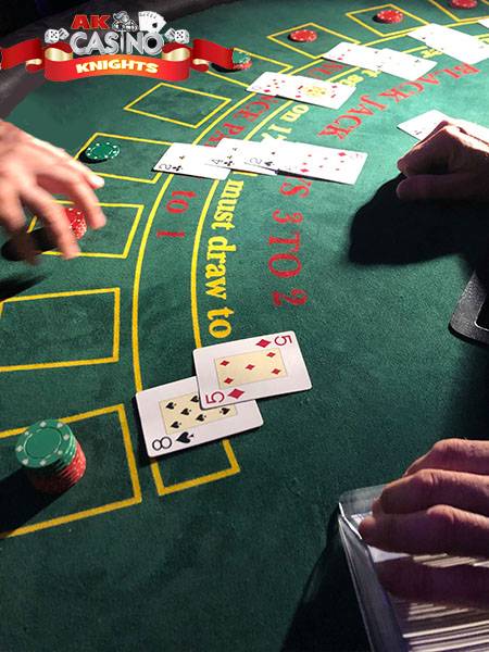 Blackjack hands being played at A K Casino Knights